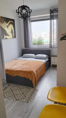 Łóżko lub łóżka w pokoju w obiekcie NightHost Kleczkowska 49 m53 Wrocław