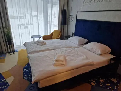 Łóżko lub łóżka w pokoju w obiekcie Biala Perla Sunny Mountain 602