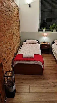 Łóżko lub łóżka w pokoju w obiekcie Noclegi Czentorycki 1