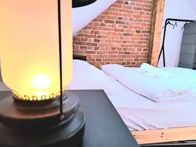 Łóżko lub łóżka w pokoju w obiekcie Browarna 14 jacuzzi, prestige