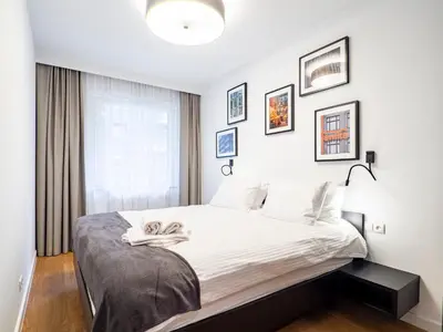 Łóżko lub łóżka w pokoju w obiekcie City Comfort Wrocław