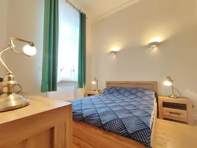 Łóżko lub łóżka w pokoju w obiekcie Bresly Apartament Old Town Wrocław