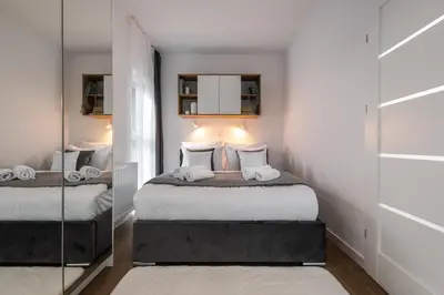 Łóżko lub łóżka w pokoju w obiekcie Apartamenty Jaworska 4 Wrocław