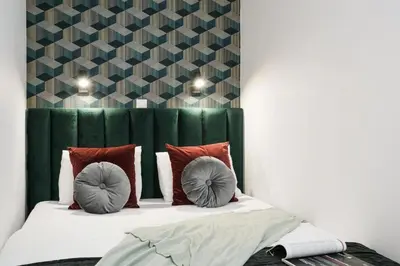 Łóżko lub łóżka w pokoju w obiekcie Apartamenty na Jaworskiej Wrocław