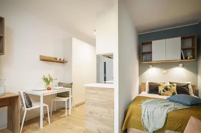 Łóżko lub łóżka w pokoju w obiekcie Apartamenty na Jaworskiej Wrocław