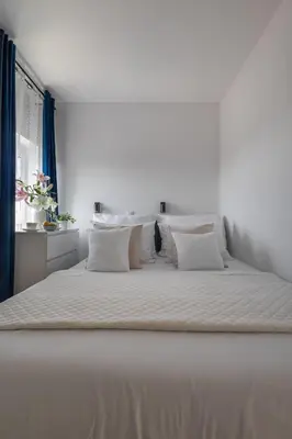 Łóżko lub łóżka w pokoju w obiekcie Apartamenty we Wrocławiu - Jaworska