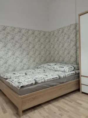 Łóżko lub łóżka w pokoju w obiekcie Apartament Rydygiera