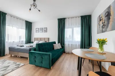 Łóżko lub łóżka w pokoju w obiekcie Apartamenty RIO Skarbimierz-Osiedle