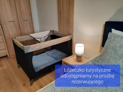 Łóżko lub łóżka w pokoju w obiekcie Chabrowa Apartamenty 1