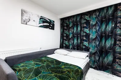 Łóżko lub łóżka w pokoju w obiekcie Zielony Apartament Gliwice