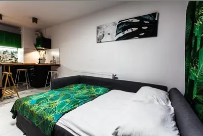 Łóżko lub łóżka w pokoju w obiekcie Zielony Apartament Gliwice