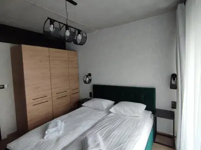 Łóżko lub łóżka w pokoju w obiekcie Apartament 413 Biała Perła