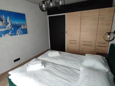 Łóżko lub łóżka w pokoju w obiekcie Apartament 413 Biała Perła