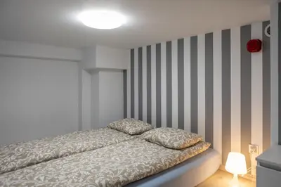 Łóżko lub łóżka w pokoju w obiekcie Studia przy lotnisku od WroclawApartament-pl