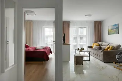 Łóżko lub łóżka w pokoju w obiekcie Apartament SUNRISE Kudowa z balkonem