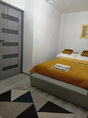 Łóżko lub łóżka w pokoju w obiekcie Apartament Radiostacja, parking free, klimatyzacja