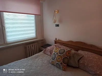 Łóżko lub łóżka w pokoju w obiekcie Mieszkanie Antoni