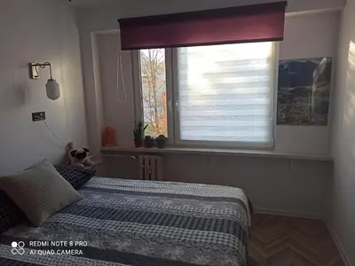 Łóżko lub łóżka w pokoju w obiekcie Mieszkanie Antoni