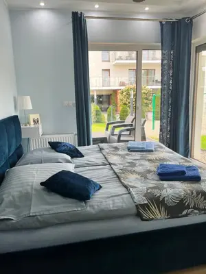 Łóżko lub łóżka w pokoju w obiekcie Apartament „Słoneczna Polana” Kudowa Zdrój