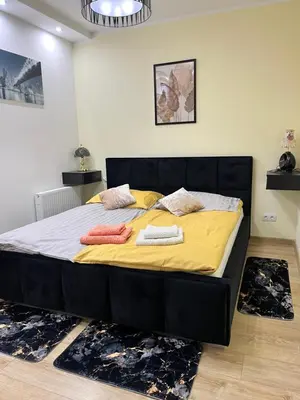 Łóżko lub łóżka w pokoju w obiekcie Apartament „Słoneczna Polana” Kudowa Zdrój