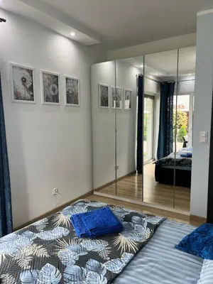 Łóżko lub łóżka w pokoju w obiekcie Apartament „Słoneczna Polana” Kudowa Zdrój