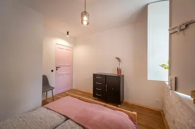 Łóżko lub łóżka w pokoju w obiekcie Apartamenty Śnieżna 12 Lądek- Zdrój