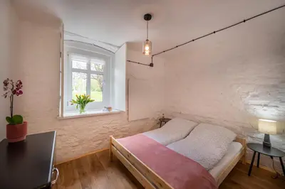 Łóżko lub łóżka w pokoju w obiekcie Apartamenty Śnieżna 12 Lądek- Zdrój