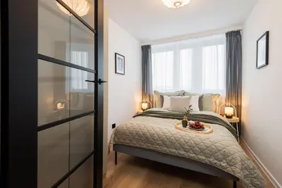 Łóżko lub łóżka w pokoju w obiekcie Kairos Apartments - Silver - darmowy Parking, ścisłe centrum