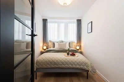 Łóżko lub łóżka w pokoju w obiekcie Kairos Apartments - Silver - darmowy Parking, ścisłe centrum
