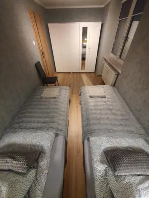Łóżko lub łóżka w pokoju w obiekcie JDK Apartamenty Młynarska 44m2 6-osobowy