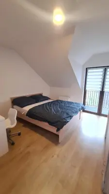 Łóżko lub łóżka w pokoju w obiekcie Dom pod Wroclawiem23