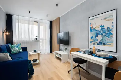 Telewizja i/lub zestaw kina domowego w obiekcie Kairos Apartments - Gold - darmowy Parking, ścisłe centrum