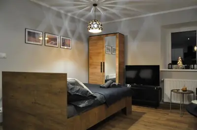 Telewizja i/lub zestaw kina domowego w obiekcie Apartamenty Sudety