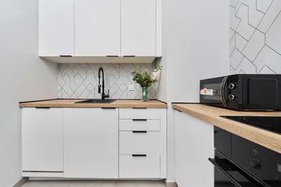Kuchnia lub aneks kuchenny w obiekcie Nowa Manufaktura Apartment Wrocław Krzyki by Noclegi Renters