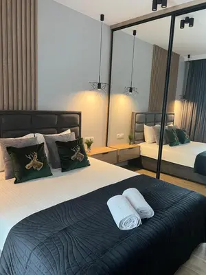 Łóżko lub łóżka w pokoju w obiekcie Apartamentowiec Opole