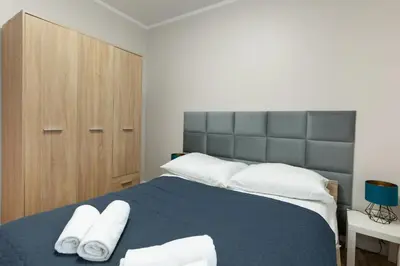 Łóżko lub łóżka w pokoju w obiekcie Apartament Słoneczny z tarasem i ogrodem