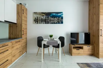 Telewizja i/lub zestaw kina domowego w obiekcie Apartament Ażurowy