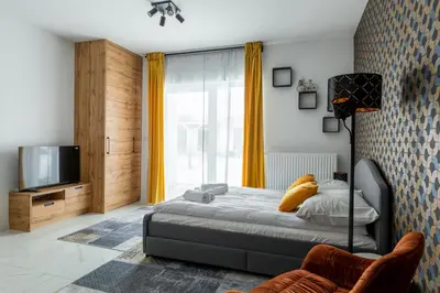 Łóżko lub łóżka w pokoju w obiekcie Apartament Ażurowy