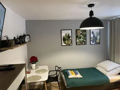 Łóżko lub łóżka w pokoju w obiekcie Apartamenty Błogi Sen II- komfortowy nocleg w spokojnej lokalizacji