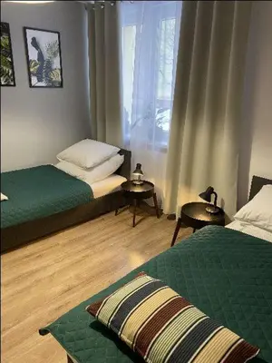 Łóżko lub łóżka w pokoju w obiekcie Apartamenty Błogi Sen II- komfortowy nocleg w spokojnej lokalizacji