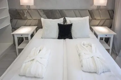 Łóżko lub łóżka w pokoju w obiekcie Apartament z kominkiem.. and SPA, MyWeek