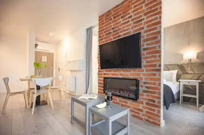 Telewizja i/lub zestaw kina domowego w obiekcie Apartament z kominkiem.. and SPA, MyWeek