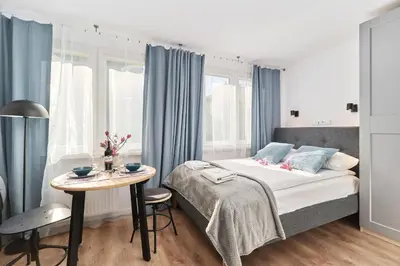 Łóżko lub łóżka w pokoju w obiekcie City Center Studio Apartment Wrocław by Noclegi Renters