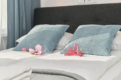 Łóżko lub łóżka w pokoju w obiekcie City Center Studio Apartment Wrocław by Noclegi Renters