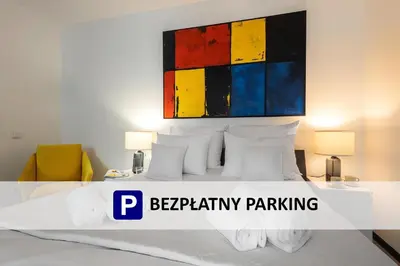 Łóżko lub łóżka w pokoju w obiekcie Aparthotel Solskiego Wrocław