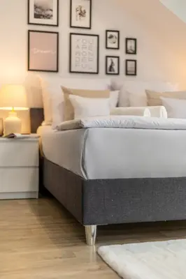 Łóżko lub łóżka w pokoju w obiekcie Aparthotel Solskiego Wrocław