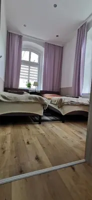 Łóżko lub łóżka w pokoju w obiekcie Apartament Pod Bukiem