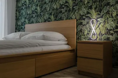 Łóżko lub łóżka w pokoju w obiekcie Apartament Rodzinny - Lamelowy Domek