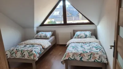 Łóżko lub łóżka w pokoju w obiekcie Dom pod Wroclawiem16