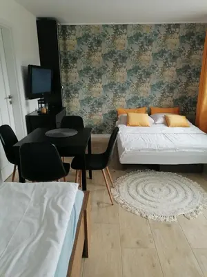 Łóżko lub łóżka w pokoju w obiekcie Apartament u Przewodnika Sudeckiego